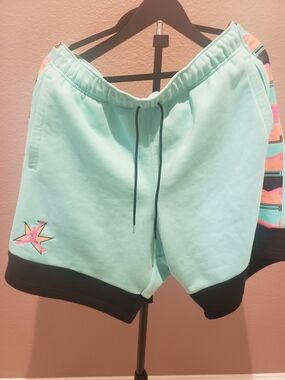 The Nike Jordan AJ11 Fleece Shorts in the "Tropical Twist"